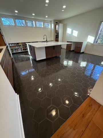 Luxury polished porcelain floor installation by Alliance Construction.